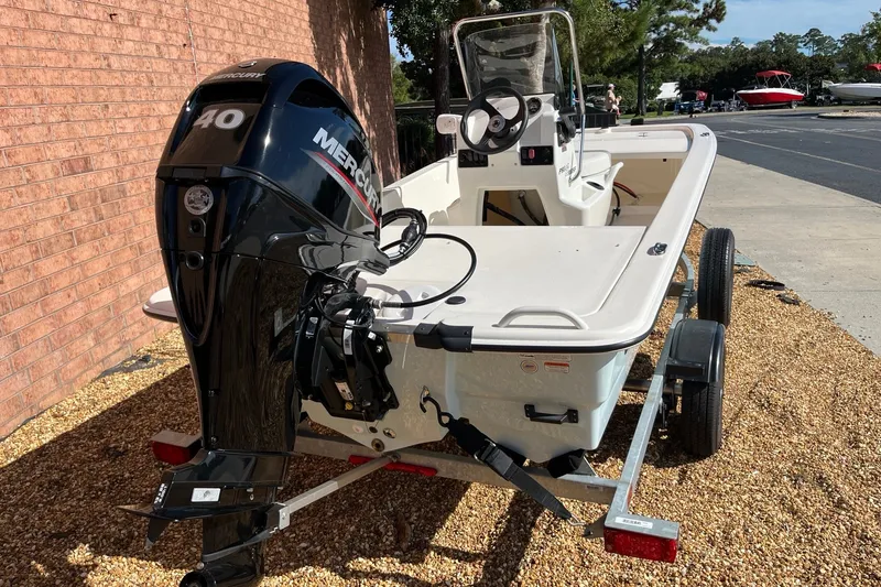 Slide: The Image of 2025 Mako Pro Skiff 13 CC boat with Mercury 40 engine on trailer. - 4