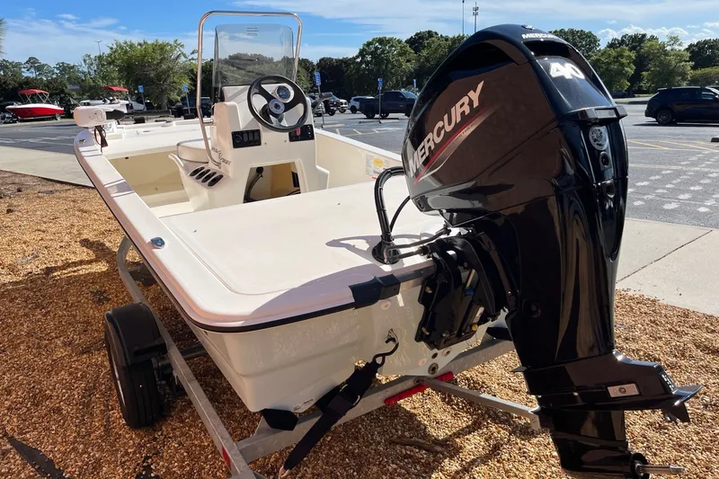 Slide: The Image of 2025 Mako Pro Skiff 13 CC boat with Mercury 40 HP engine on trailer. - 3