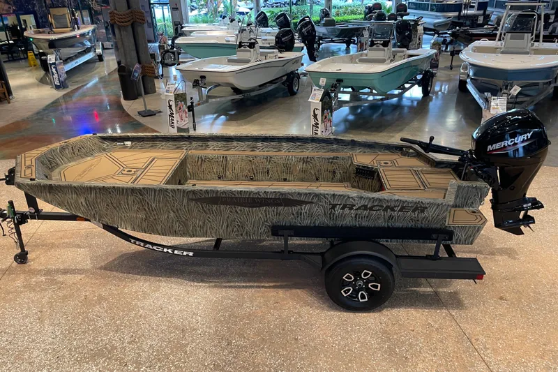 The Image of 2026 Tracker Grizzly 1650 T Prairie Wings Edition boat with Mercury engine in showroom. - 0