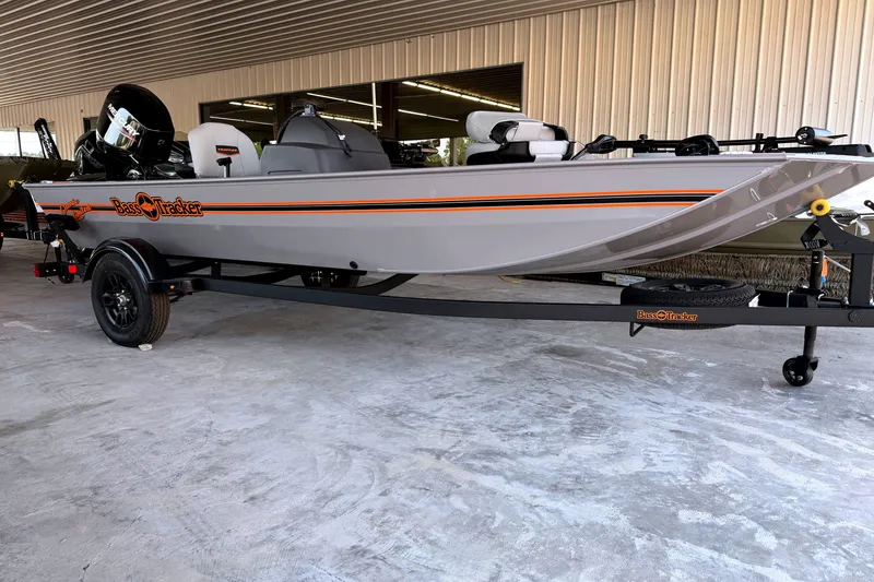 The Image of 2027 Tracker Bass Tracker Classic Limited boat on trailer in showroom. - 0