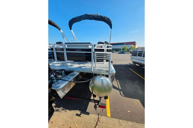 Slide: The Image of 2027 Sun Tracker Fishin' Barge 22 DLX pontoon boat in parking lot. - 101