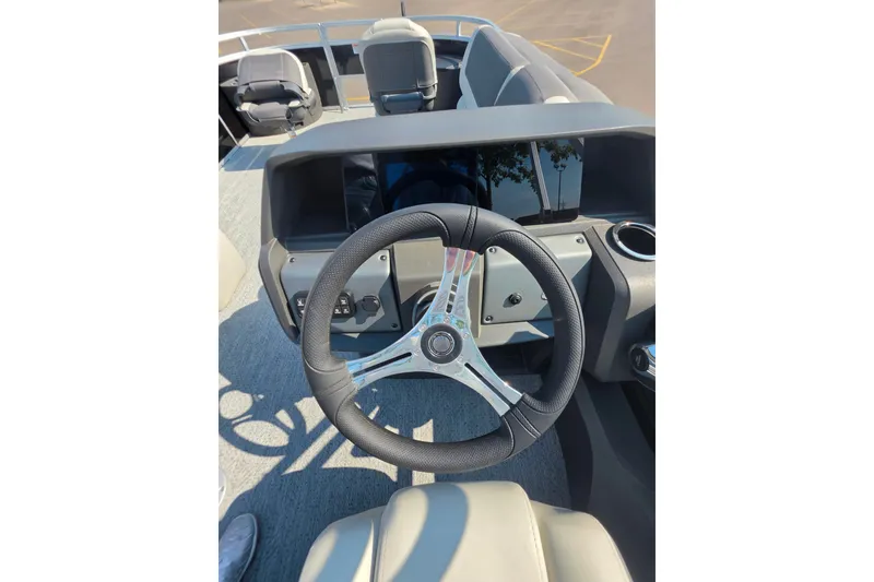 Slide: The Image of Steering wheel of 2027 Sun Tracker Fishin' Barge 22 DLX pontoon boat. - 13