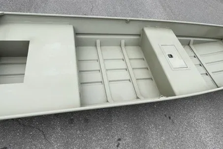 The Image of 2027 Tracker Grizzly 15 Jon boat interior, showcasing seating and storage compartments. - 0