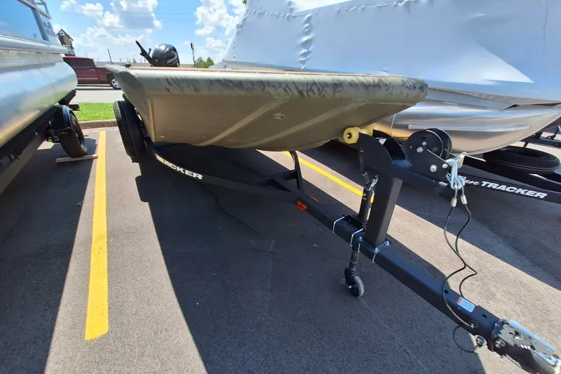 The Image of 2027 Tracker Grizzly 1756 T Marsh boat on trailer in parking lot. - 0