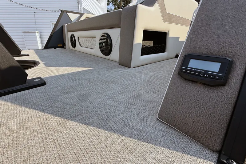 Slide: The Image of Interior of 2027 Alera A20L boat with modern audio system and textured flooring. - 18