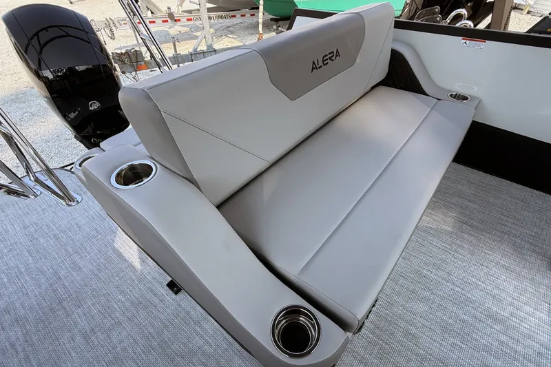 Slide: The Image of Alera A20L 2027 boat interior with gray seating and cup holders. - 16