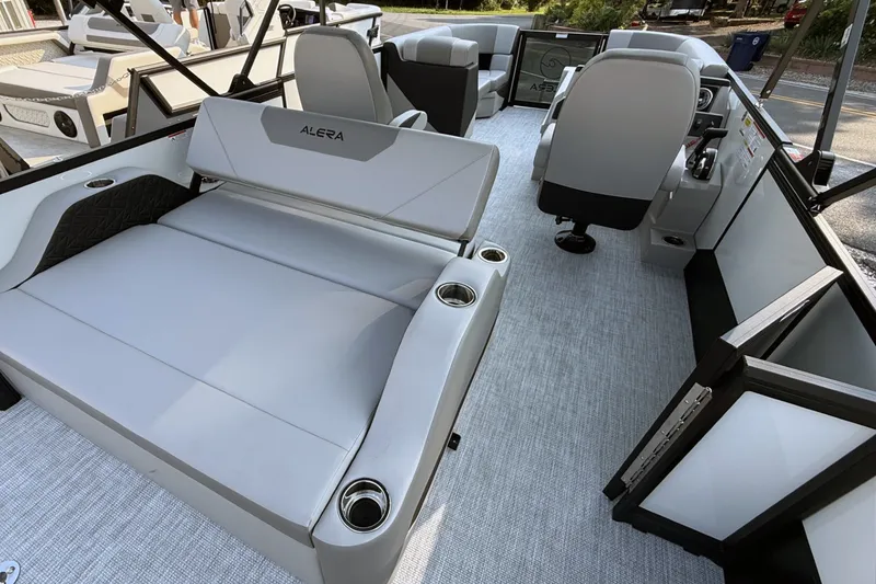 Slide: The Image of Interior of 2027 Alera A20L boat with modern seating and controls. - 14