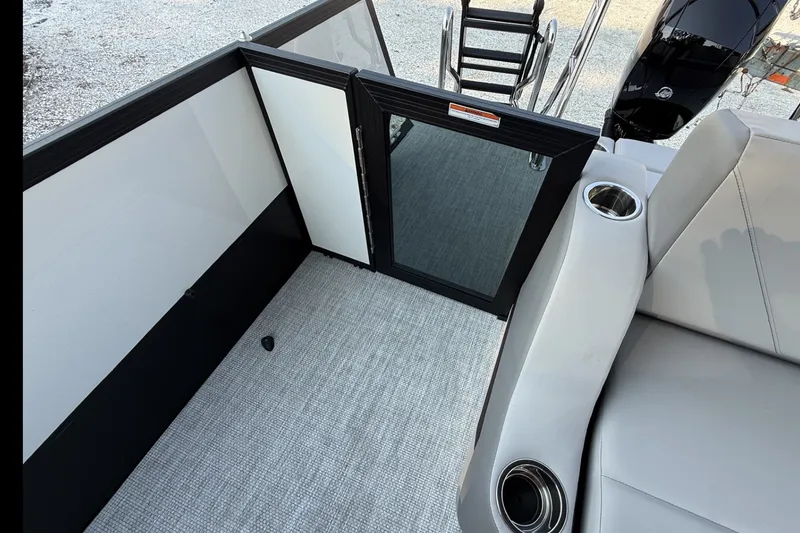 Slide: The Image of Interior of 2027 Alera A20L boat with seating, cup holders, and access gate. - 17