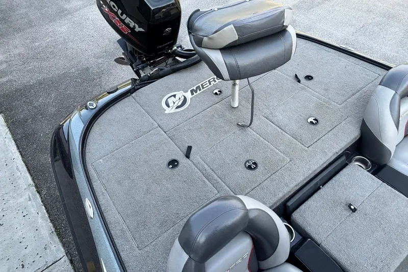 Slide: The Image of 2014 Nitro Z-8 boat deck with Mercury engine and cushioned seating. - 14