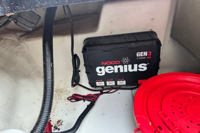 Slide: The Image of NOCO Genius GEN3 battery charger in a 2014 Nitro Z-8 boat compartment. - 16