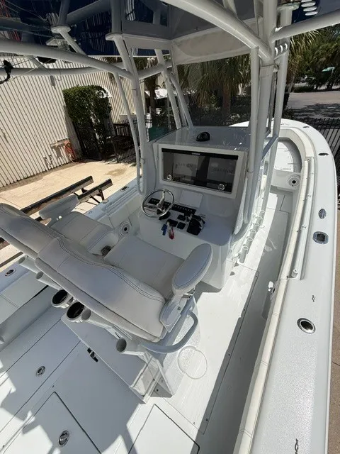 Slide: The Image of The image shows the cockpit of a 2020 Contender 28 Sport with modern control equipment. - 24