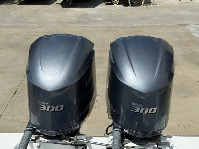 Slide: The Image of Two Yamaha 300 outboard engines are mounted on a boat, which is on a concrete surface. - 20