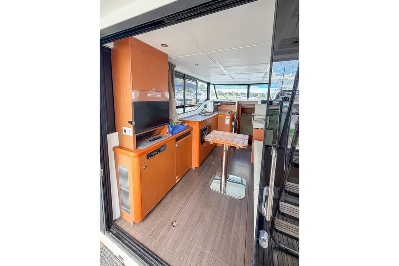Slide: The Image of Interior of 2017 Beneteau Swift Trawler 30, featuring modern wood cabinetry and seating. - 52