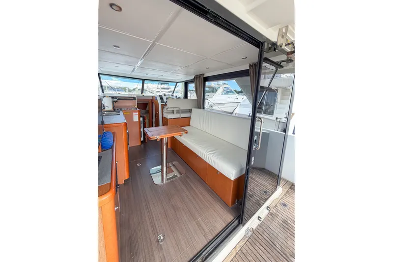 Slide: The Image of Interior of 2017 Beneteau Swift Trawler 30 with seating and table, showcasing modern design. - 51