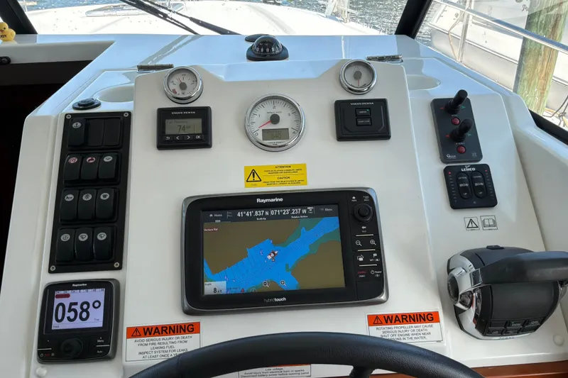 Slide: The Image of Control panel of a 2017 Beneteau Swift Trawler 30 with navigation and engine gauges. - 24
