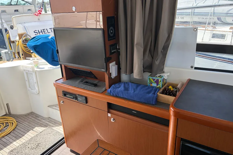 Slide: The Image of Interior of 2017 Beneteau Swift Trawler 30 with TV and storage area. - 43