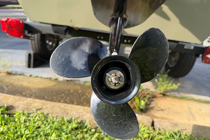 Slide: The Image of Propeller of 2025 Tracker Grizzly 1436 boat, close-up view. - 13