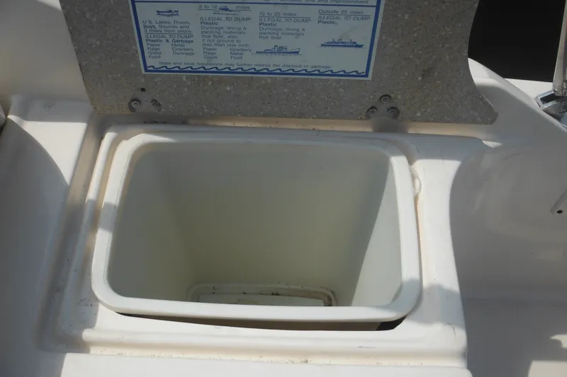 Slide: The Image of Open storage compartment on a 2005 Rinker Fiesta Vee 250 boat. - 16