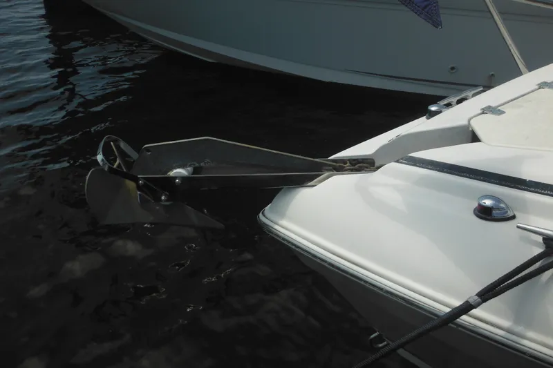 Slide: The Image of 2005 Rinker Fiesta Vee 250 boat with anchor in water. - 56