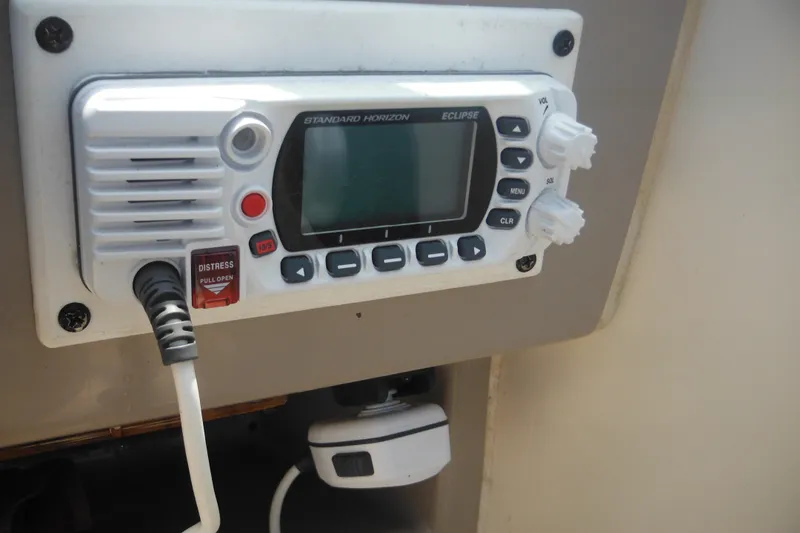 Slide: The Image of VHF radio on 2005 Rinker Fiesta Vee 250 boat dashboard. - 26