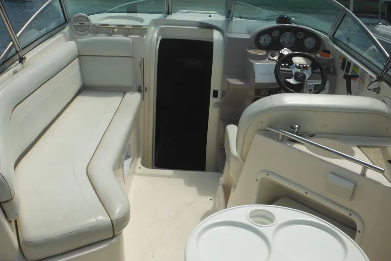 Slide: The Image of 2005 Rinker Fiesta Vee 250 boat interior with seating and steering console. - 54