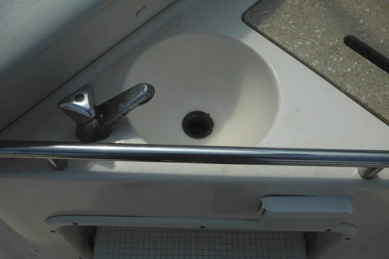 Slide: The Image of 2005 Rinker Fiesta Vee 250 boat sink with faucet and countertop. - 17