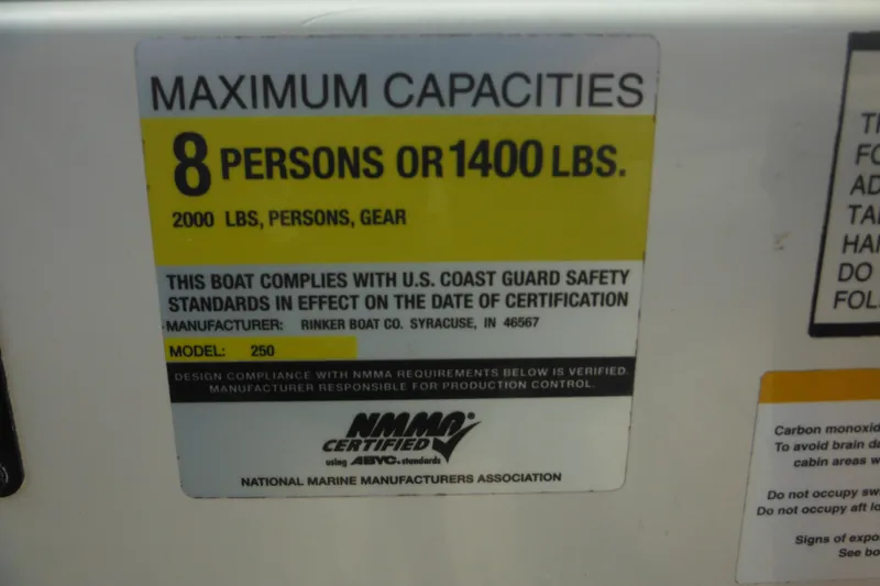 Slide: The Image of 2005 Rinker Fiesta Vee 250 capacity label, maximum 8 persons or 1400 lbs, NMMA certified. - 22
