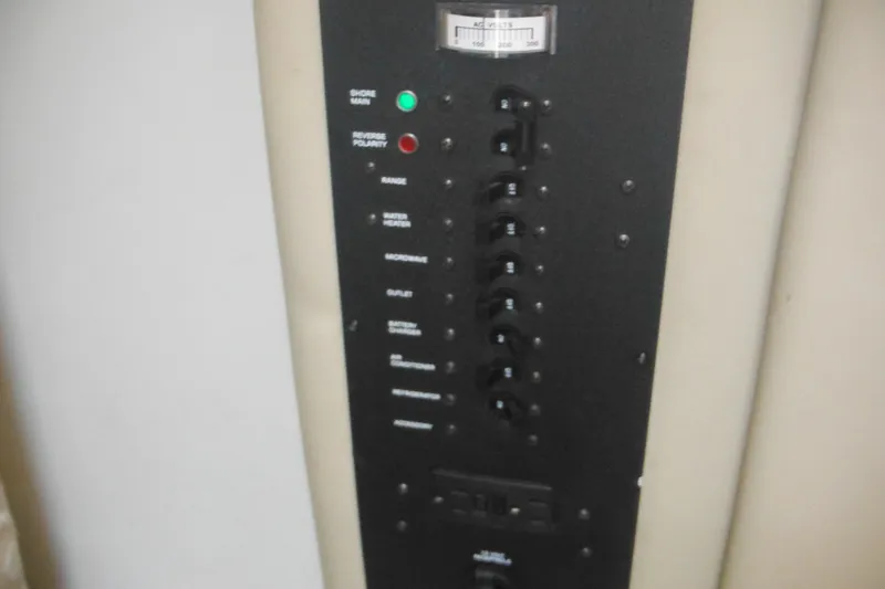 Slide: The Image of Control panel of a 2005 Rinker Fiesta Vee 250 boat with labeled switches. - 34