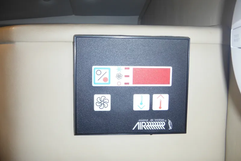 Slide: The Image of Control panel of a 2005 Rinker Fiesta Vee 250 boat's marine air system. - 38