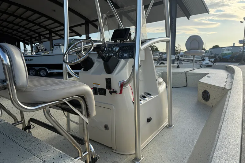 Slide: The Image of 2015 Xpress H24 Bay boat interior with steering console and seating. - 14