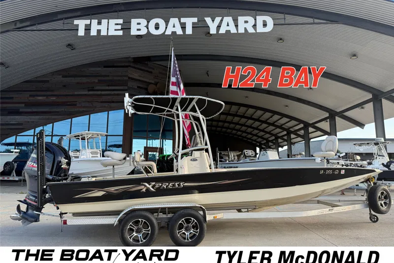 The Image of 2015 Xpress H24 Bay boat displayed at The Boat Yard dealership. - 1