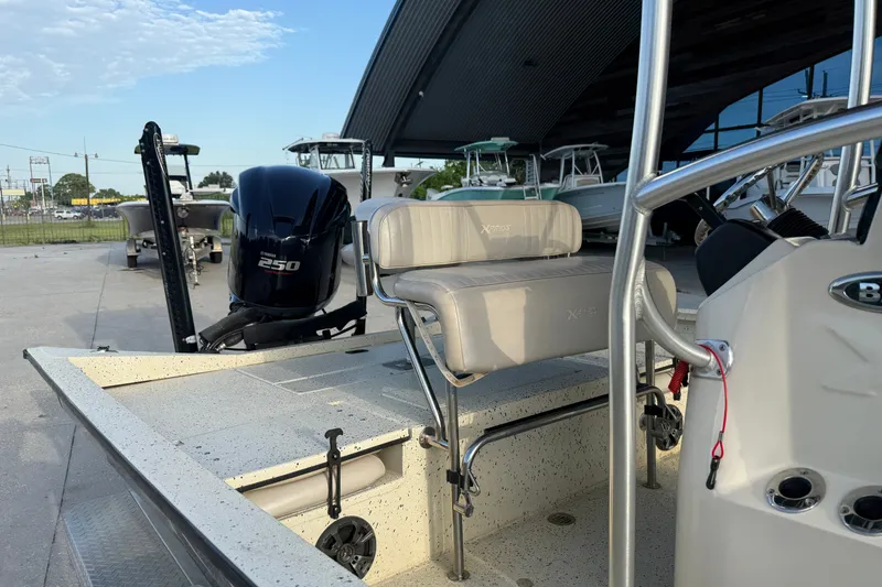 Slide: The Image of 2015 Xpress H24 Bay boat with Yamaha 250 engine, parked outdoors. - 17
