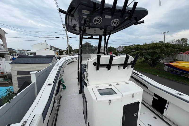 Slide: The Image of 2023 Tidewater 282 CC Adventure Bluewater boat with center console and rod holders. - 18