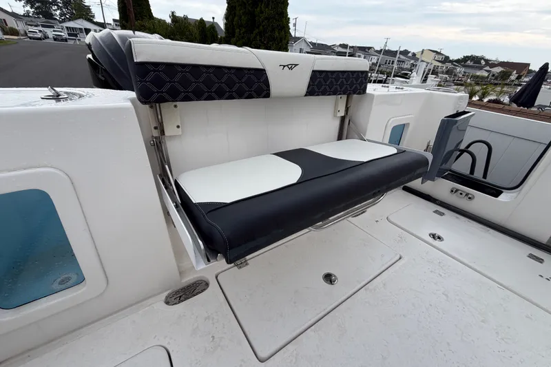 Slide: The Image of 2023 Tidewater 282 CC Adventure Bluewater boat with foldable seating on deck. - 23