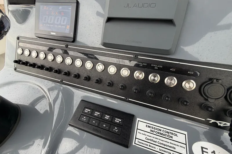 Slide: The Image of 2023 Tidewater 282 CC Adventure Bluewater dashboard with controls and JL Audio system. - 17