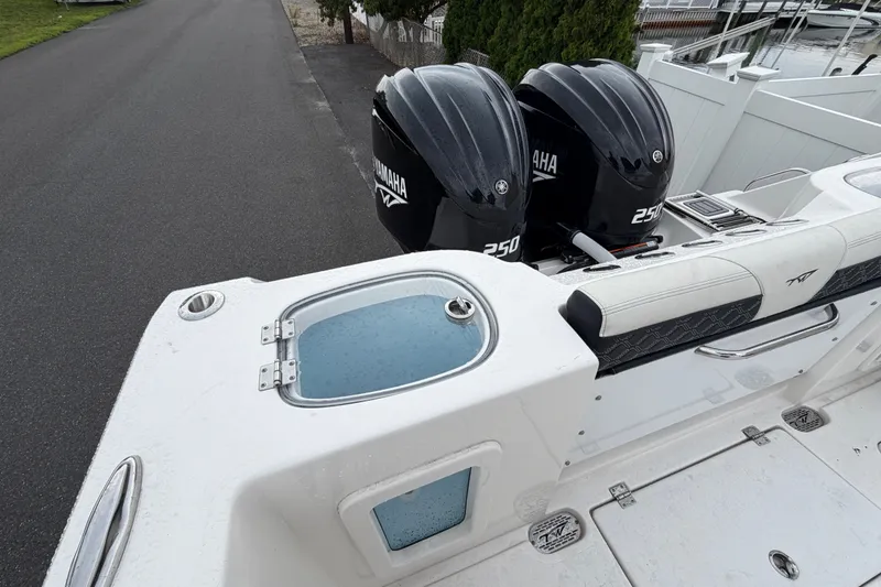 Slide: The Image of 2023 Tidewater 282 CC Adventure Bluewater boat with dual Yamaha 250 engines. - 22
