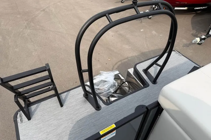 Slide: The Image of 2027 Godfrey Sweetwater 2086 C boat deck with black railing and ladder. - 16
