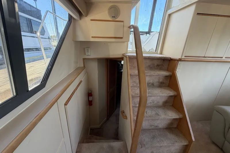 Slide: The Image of Interior stairs of 1996 Carver 370 Aft Cabin Motor Yacht with carpeted steps. - 22