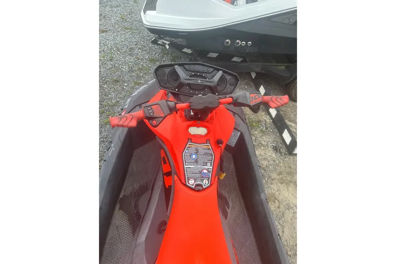 Slide: The Image of 2022 Sea-Doo Spark Trixx handlebars and dashboard, vibrant red design. - 6
