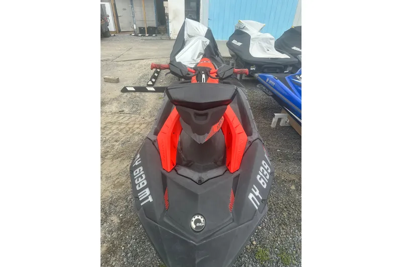 Slide: The Image of 2022 Sea-Doo Spark Trixx jet ski in a storage area, front view. - 5