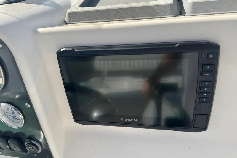 Slide: The Image of Garmin navigation system on 2005 Sea Hunt Triton 220 boat dashboard. - 11