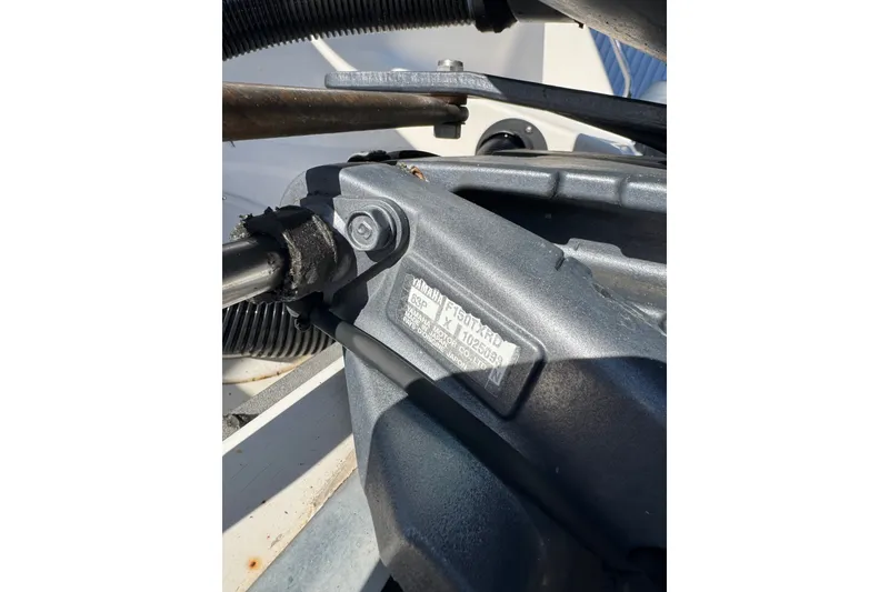 Slide: The Image of Close-up of a Yamaha engine part on a 2005 Sea Hunt Triton 220 boat. - 5