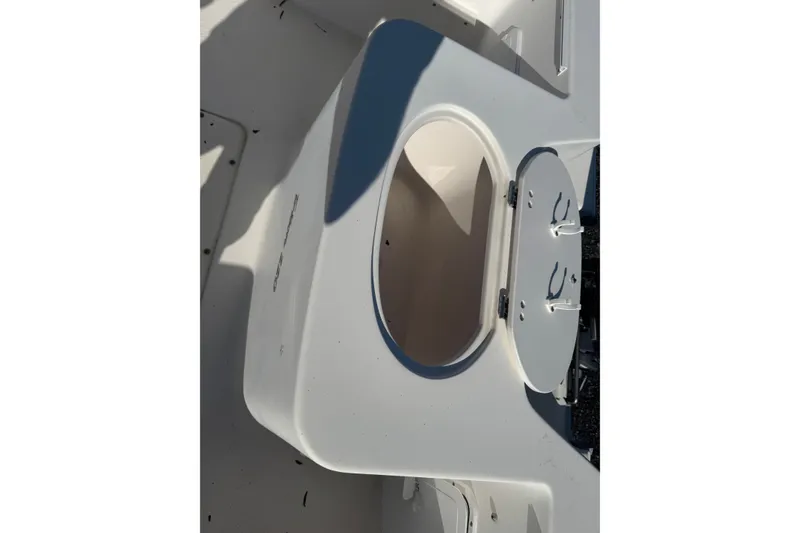 Slide: The Image of Open storage compartment on a 2005 Sea Hunt Triton 220 boat. - 6