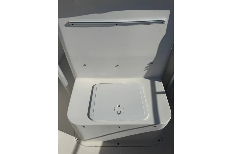 Slide: The Image of 2005 Sea Hunt Triton 220 boat storage compartment with lid, white interior. - 18