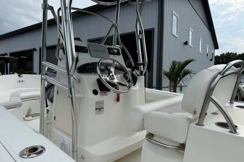 Slide: The Image of 2006 Boston Whaler 210 Outrage boat interior with steering wheel and Garmin equipment. - 5