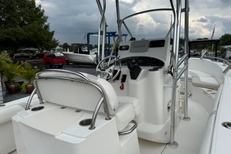 Slide: The Image of 2006 Boston Whaler 210 Outrage boat interior with steering console and seating. - 4