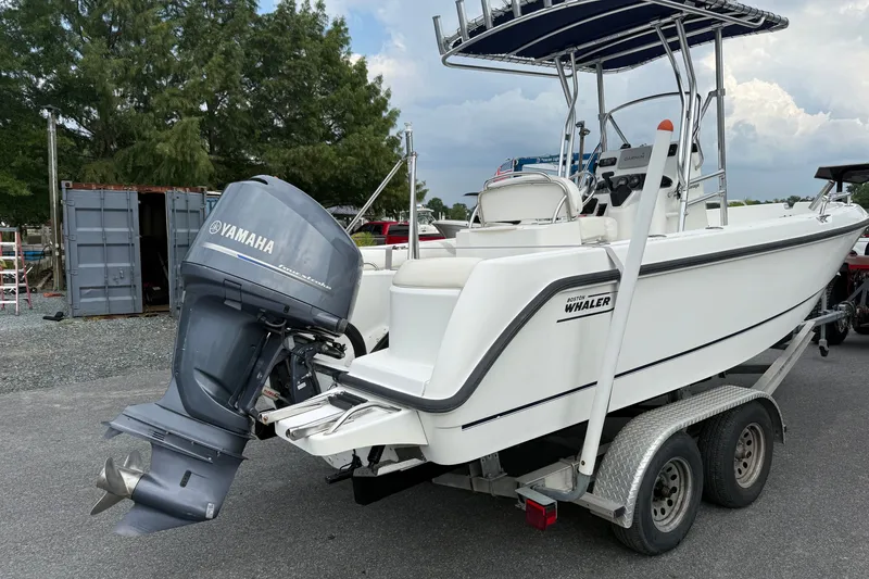 Slide: The Image of 2006 Boston Whaler 210 Outrage boat on trailer with Yamaha outboard motor. - 2