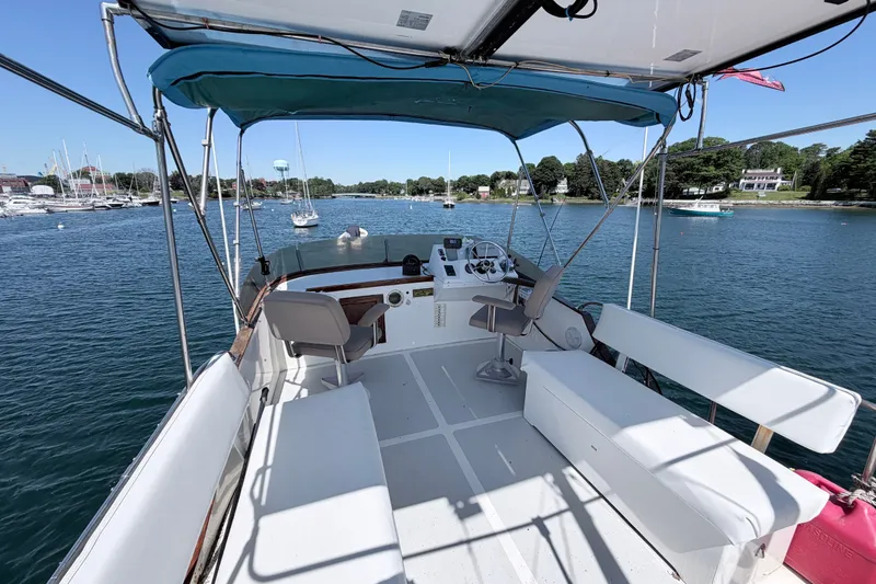 Slide: The Image of Flybridge view of 1979 Marine Trader 36 yacht on calm water. - 34