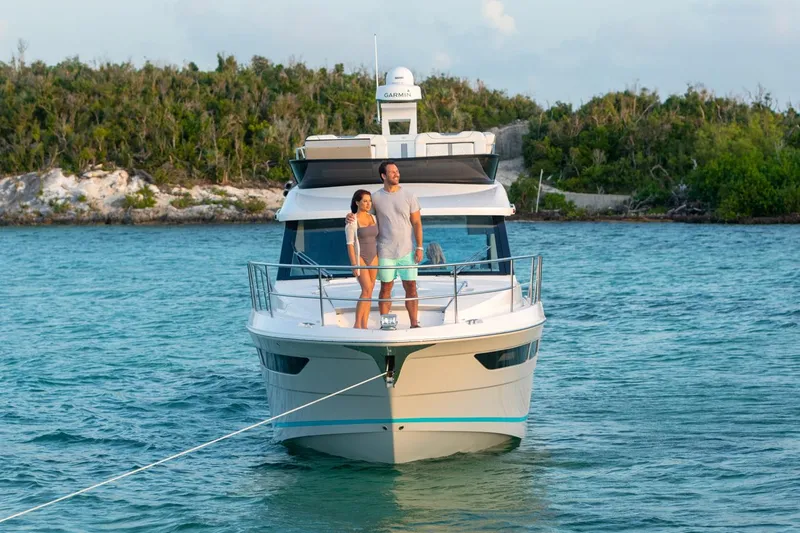 Slide: The Image of Manufacturer Provided Image: Couple enjoying a sunny day on a 2026 Regal 38 FXO yacht. - 4