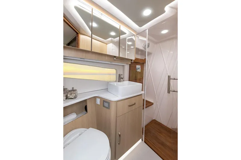 Slide: The Image of Manufacturer Provided Image: Luxurious bathroom interior of 2026 Regal 42 Grande Coupe yacht, featuring modern fixtures and elegant design. - 13